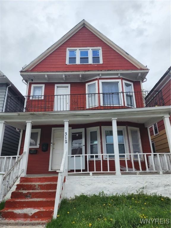 view of front facade featuring a porch and a balcony