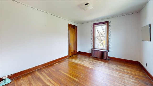 4501 State Route 414, Hector, NY 14818 - empty room featuring radiator heating unit, baseboards, and light wood finished floors