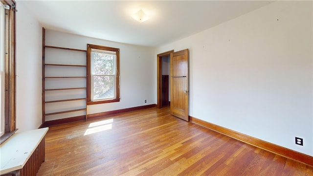 4501 State Route 414, Hector, NY 14818 - unfurnished bedroom with light wood-style flooring and baseboards