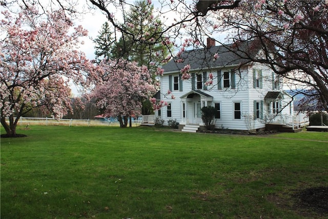 4501 State Route 414, Hector, NY 14818 - colonial-style house featuring fence, a chimney, and a front yard