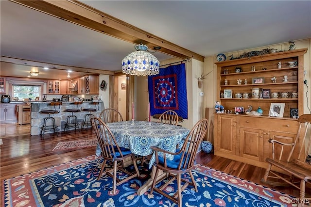 8521 N Shore Rd, Diana, NY 13648 - dining area with an inviting chandelier, wood finished floors, and beam ceiling