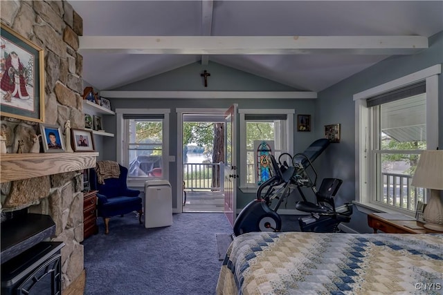 8521 N Shore Rd, Diana, NY 13648 - carpeted bedroom featuring vaulted ceiling with beams, a large fireplace, multiple windows, and access to exterior