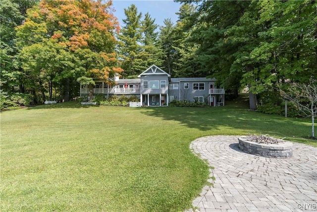 view of yard with a fire pit