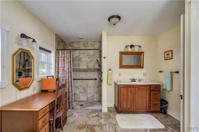 8521 N Shore Rd, Diana, NY 13648 - bathroom featuring baseboards, tiled shower, and vanity