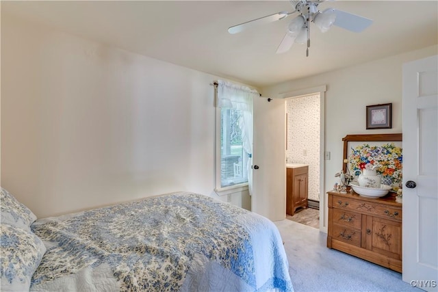 bedroom with ceiling fan and light colored carpet