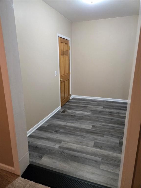 corridor featuring baseboards