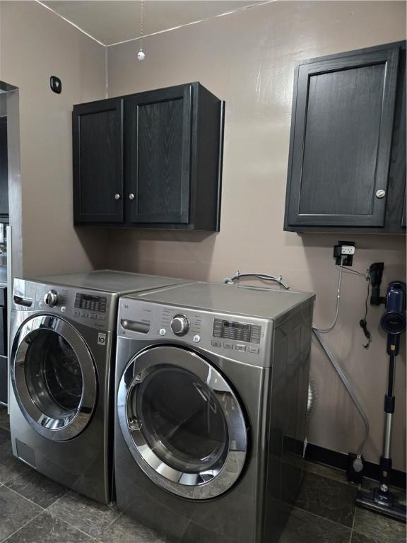 laundry area featuring cabinet space and washing machine and clothes dryer