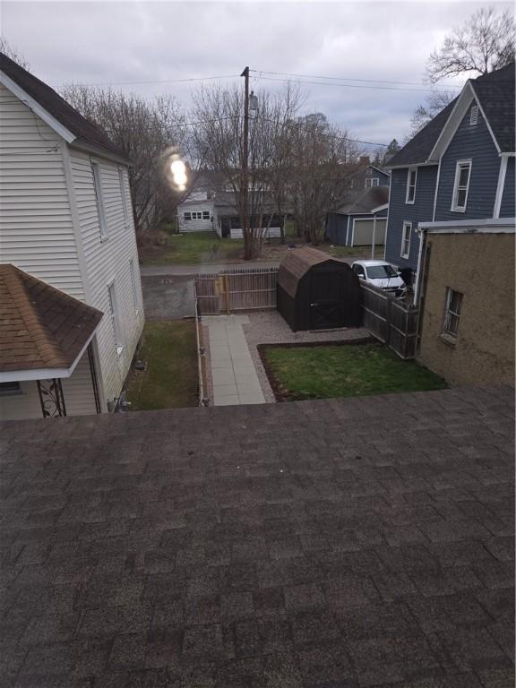 view of yard featuring a residential view and fence