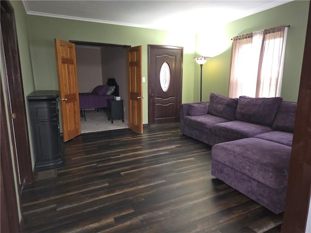 living area featuring ornamental molding and dark wood-style flooring