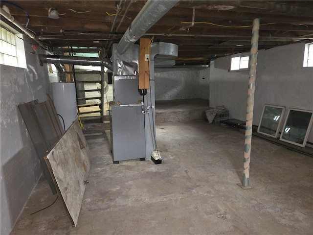 basement with gas water heater and heating unit