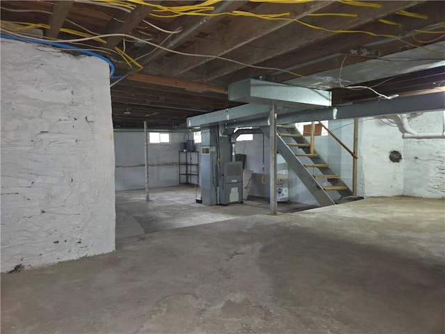 below grade area with stairway and heating unit