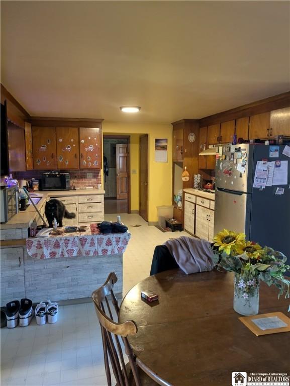 dining room with tile patterned floors