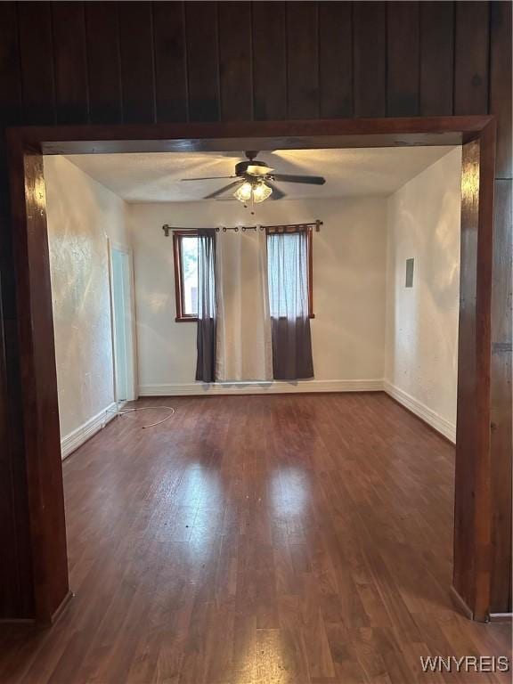 396 Guilford St, Buffalo, NY 14211 - spare room with baseboards, dark wood-style floors, and ceiling fan