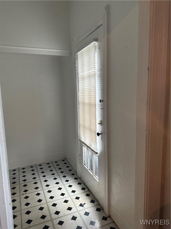 396 Guilford St, Buffalo, NY 14211 - entryway featuring a wealth of natural light, baseboards, and light floors