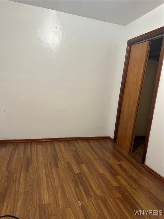 396 Guilford St, Buffalo, NY 14211 - empty room featuring wood finished floors and baseboards