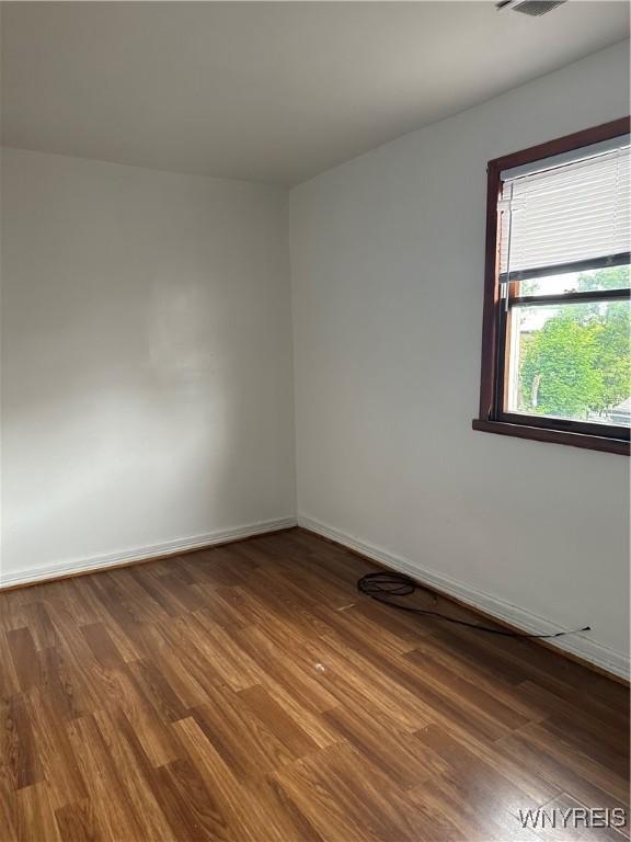 396 Guilford St, Buffalo, NY 14211 - empty room featuring dark wood finished floors and baseboards