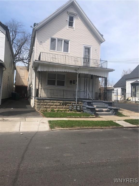 396 Guilford St, Buffalo, NY 14211 - view of front of house with a porch and a balcony