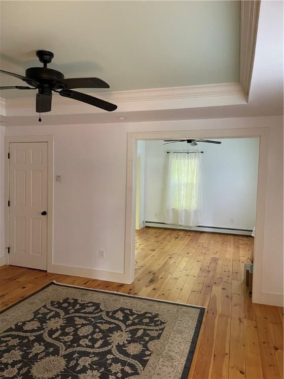 10 Orchard St Unit 8, Urbana, NY 14840 - interior space featuring light wood-style floors, a ceiling fan, baseboards, and ornamental molding