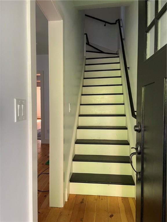 10 Orchard St Unit 8, Urbana, NY 14840 - staircase with wood-type flooring