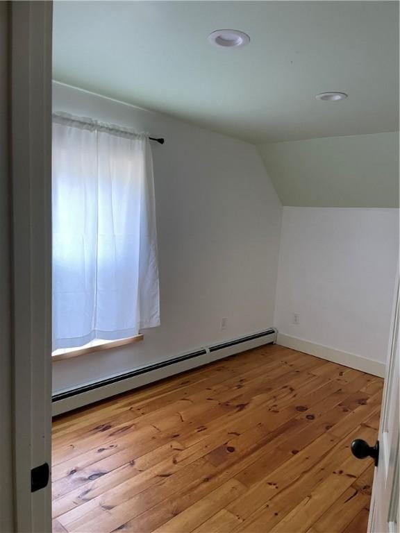 10 Orchard St Unit 8, Urbana, NY 14840 - bonus room featuring baseboard heating, baseboards, wood-type flooring, lofted ceiling, and recessed lighting