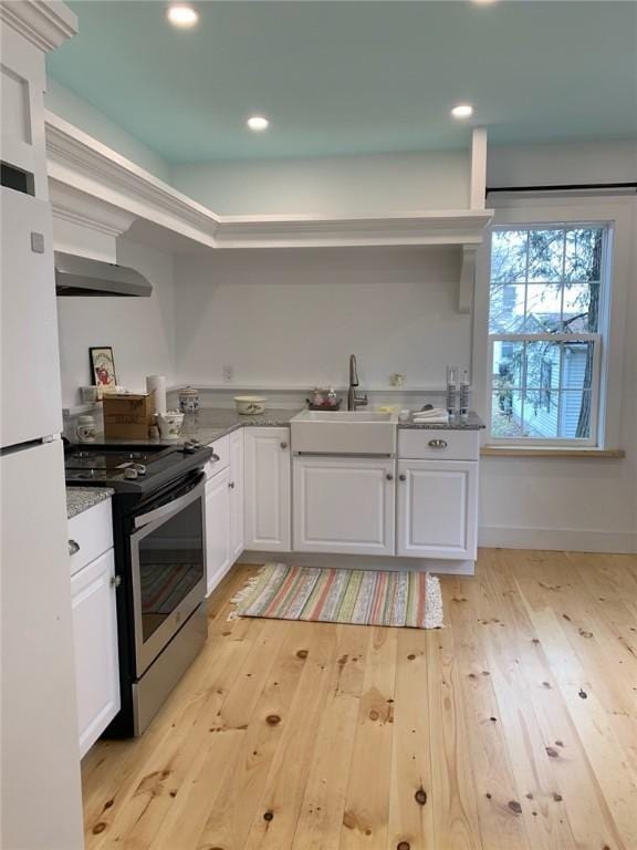 10 Orchard St Unit 8, Urbana, NY 14840 - kitchen with a sink, freestanding refrigerator, stainless steel electric range, and light wood-type flooring