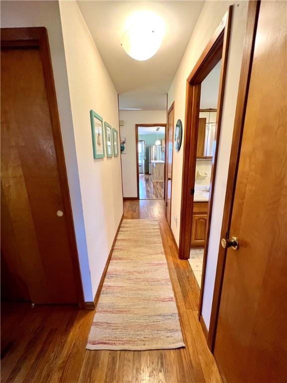 3460 County Road 28, Reading, NY 14891 - hallway with light wood-style flooring and baseboards