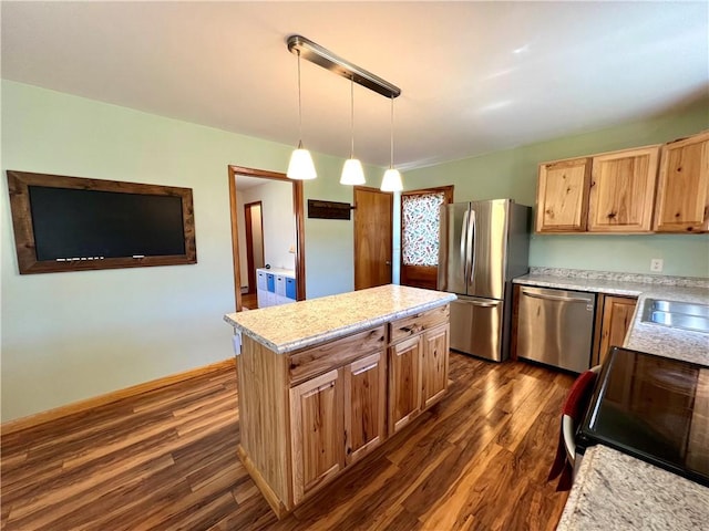 3460 County Road 28, Reading, NY 14891 - kitchen featuring a center island, a sink, dark wood finished floors, pendant lighting, and appliances with stainless steel finishes