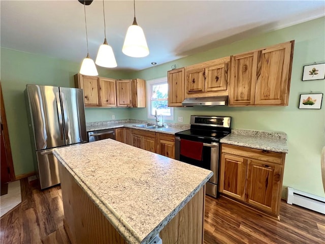 3460 County Road 28, Reading, NY 14891 - kitchen with a baseboard radiator, a sink, stainless steel appliances, light countertops, and under cabinet range hood