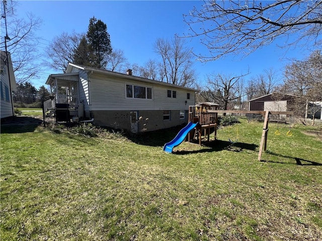 3460 County Road 28, Reading, NY 14891 - rear view of property featuring a lawn, a chimney, and a playground