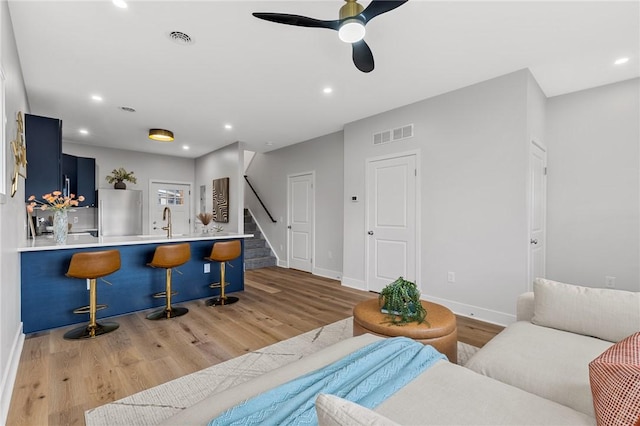 169 S Union St, Rochester, NY 14607 - living area featuring stairs, a ceiling fan, visible vents, and light wood-style floors