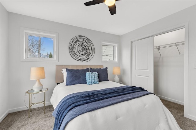 carpeted bedroom featuring ceiling fan, baseboards, and a closet