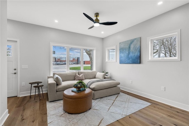 living room with recessed lighting, wood finished floors, baseboards, and ceiling fan