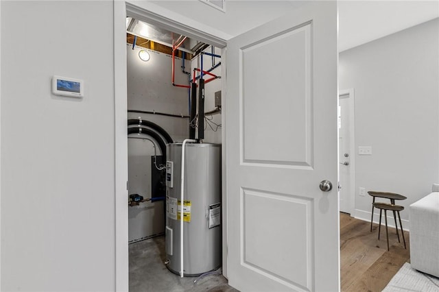 utility room featuring electric water heater