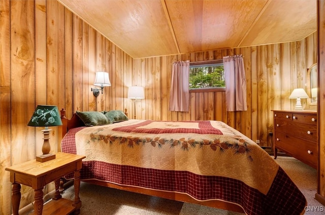 bedroom with wooden walls, carpet flooring, and wooden ceiling