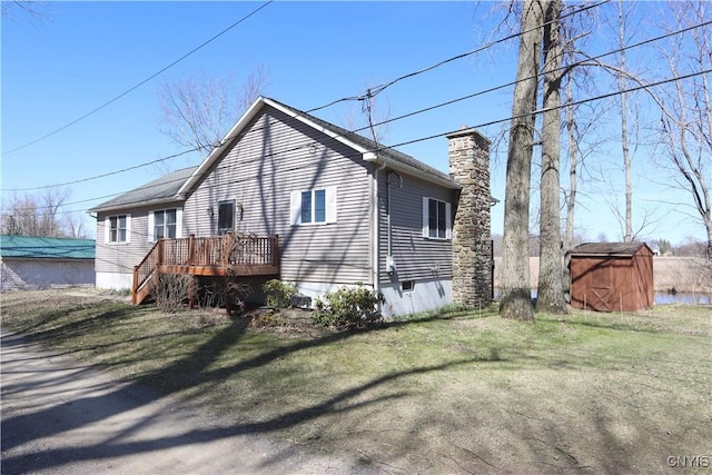 14 Renshaw Bay Rd, Sandy Creek, NY 13145 - view of side of property with a storage unit, a chimney, a yard, and an outbuilding