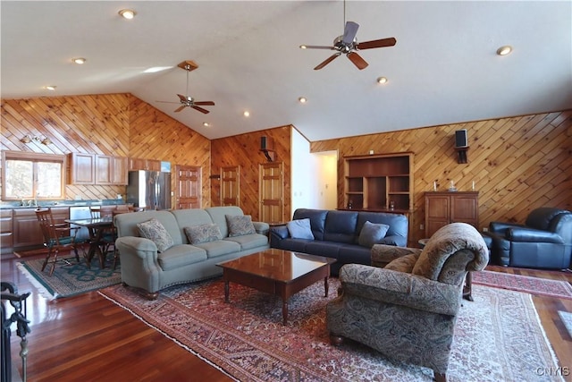 14 Renshaw Bay Rd, Sandy Creek, NY 13145 - living area featuring high vaulted ceiling, wooden walls, dark wood-style floors, and ceiling fan