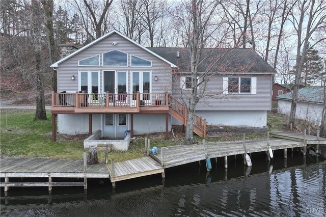 14 Renshaw Bay Rd, Sandy Creek, NY 13145 - back of property with stairway and a deck with water view