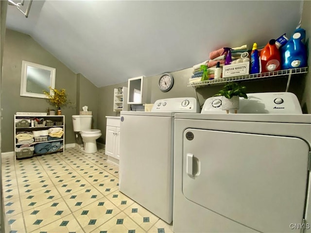 laundry room featuring light tile patterned flooring, baseboards, laundry area, and washer and clothes dryer