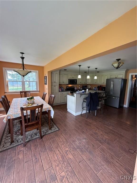 dining room with dark wood-style flooring