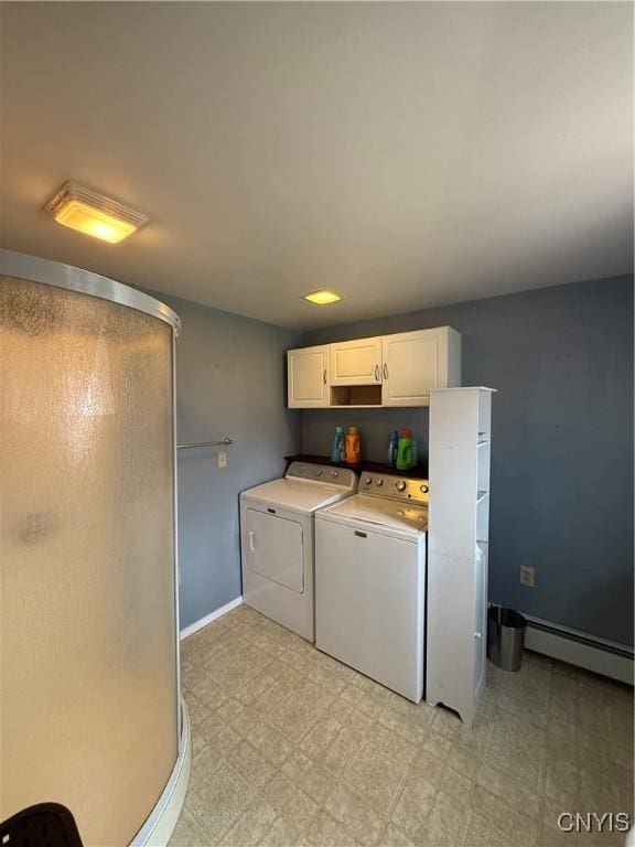 laundry area featuring a baseboard radiator, separate washer and dryer, light floors, baseboards, and laundry area