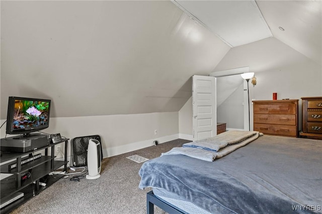 bedroom featuring vaulted ceiling and carpet floors