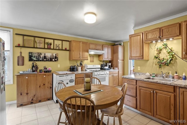 kitchen with crown molding, a sink, white appliances, light tile patterned floors, and under cabinet range hood