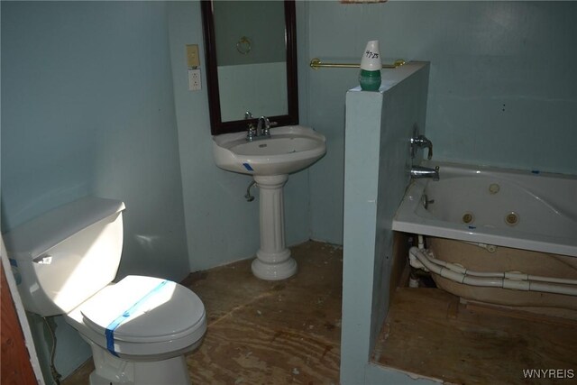 2386 Main St, Collins, NY 14034 - bathroom featuring a jetted tub and toilet