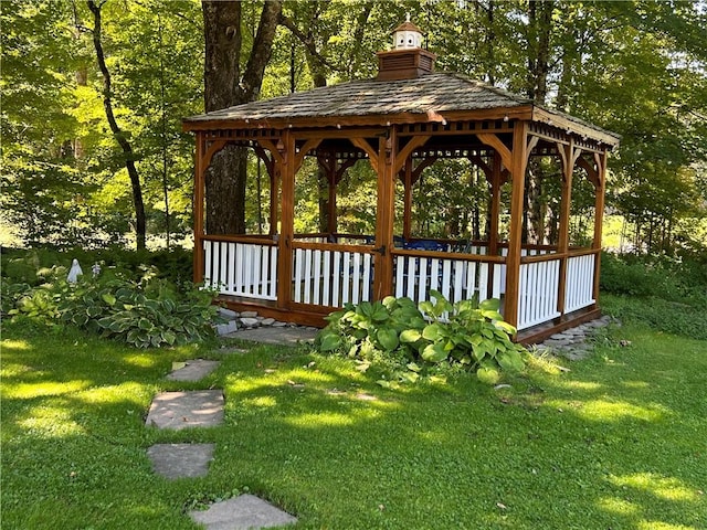 view of community with a lawn and a gazebo