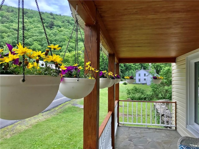 exterior space featuring a wooded view