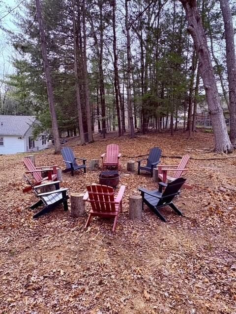 view of yard with a fire pit