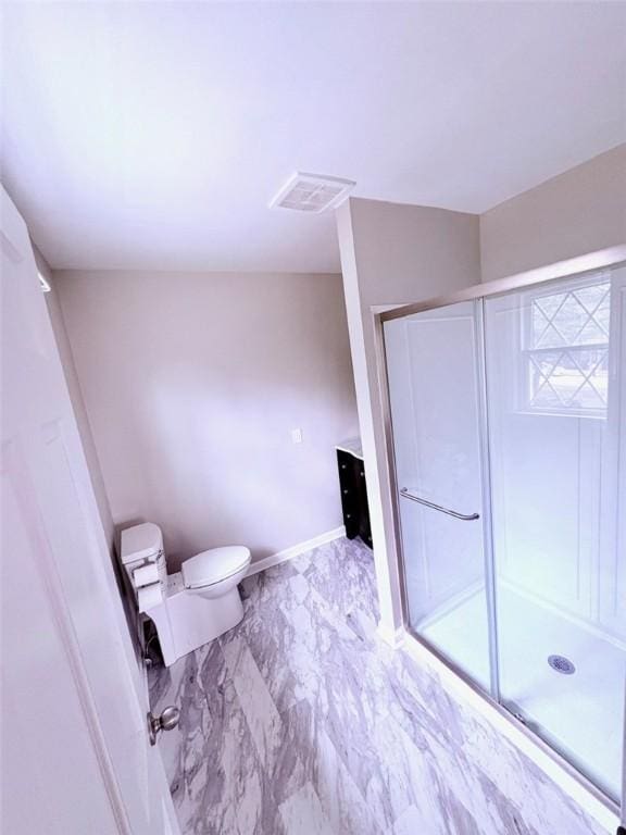 full bath with visible vents, marble finish floor, a shower stall, and toilet