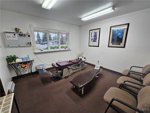 exercise room featuring baseboards