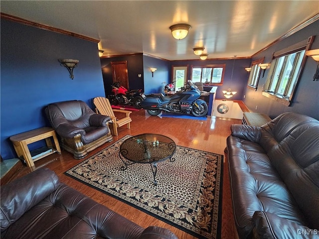living area with wood finished floors and ornamental molding