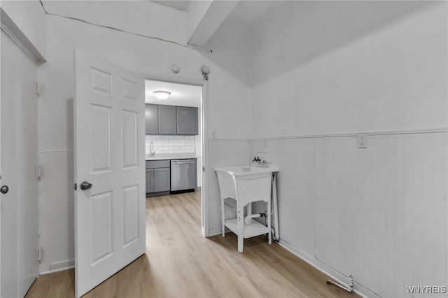 washroom featuring wainscoting and light wood-style floors